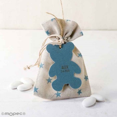 Bolsa algodón estrellitas en azul o rosa con colgante silueta osito azul y 5 peladillas de chocolate.